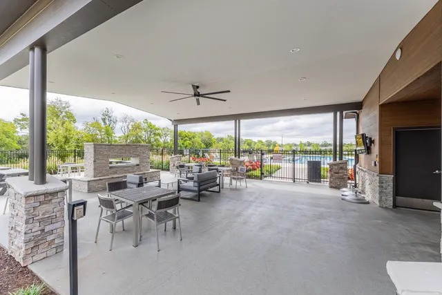 a view of a house with a yard and lake view