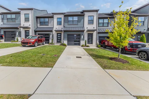 a front view of a building with garden