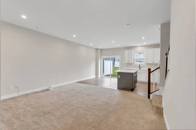 a view of a kitchen with a sink and cabinets