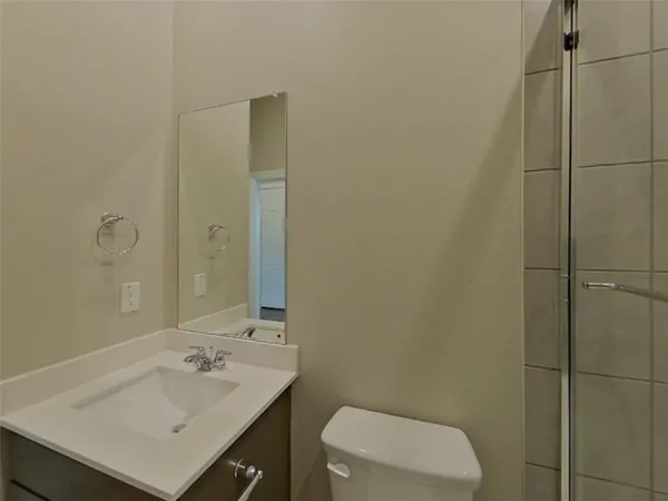 a bathroom with a sink toilet and vanity