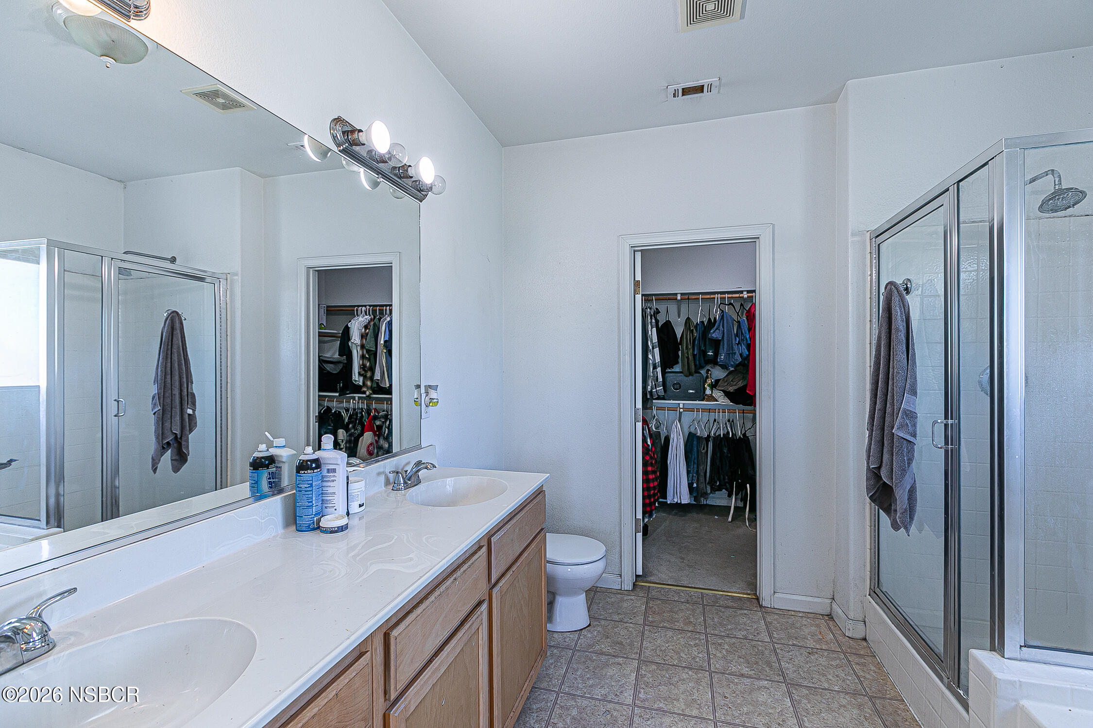 1838 Gable Lane Santa Maria, CA 93458 - Photo 21 of 31 a bathroom with a sink double vanity and shower
