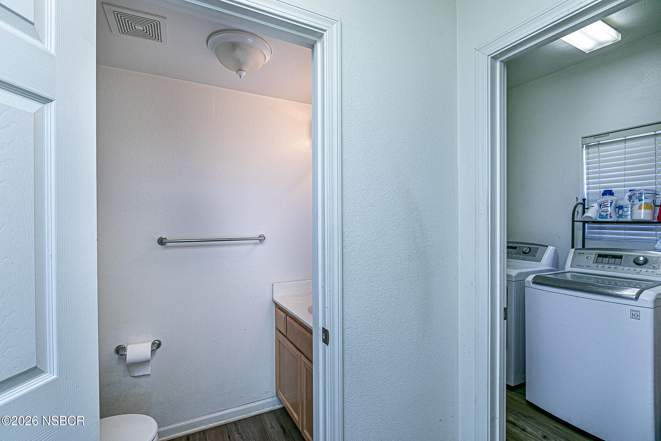 1838 Gable Lane Santa Maria, CA 93458 - Photo 27 of 31 a bathroom with a toilet sink and mirror