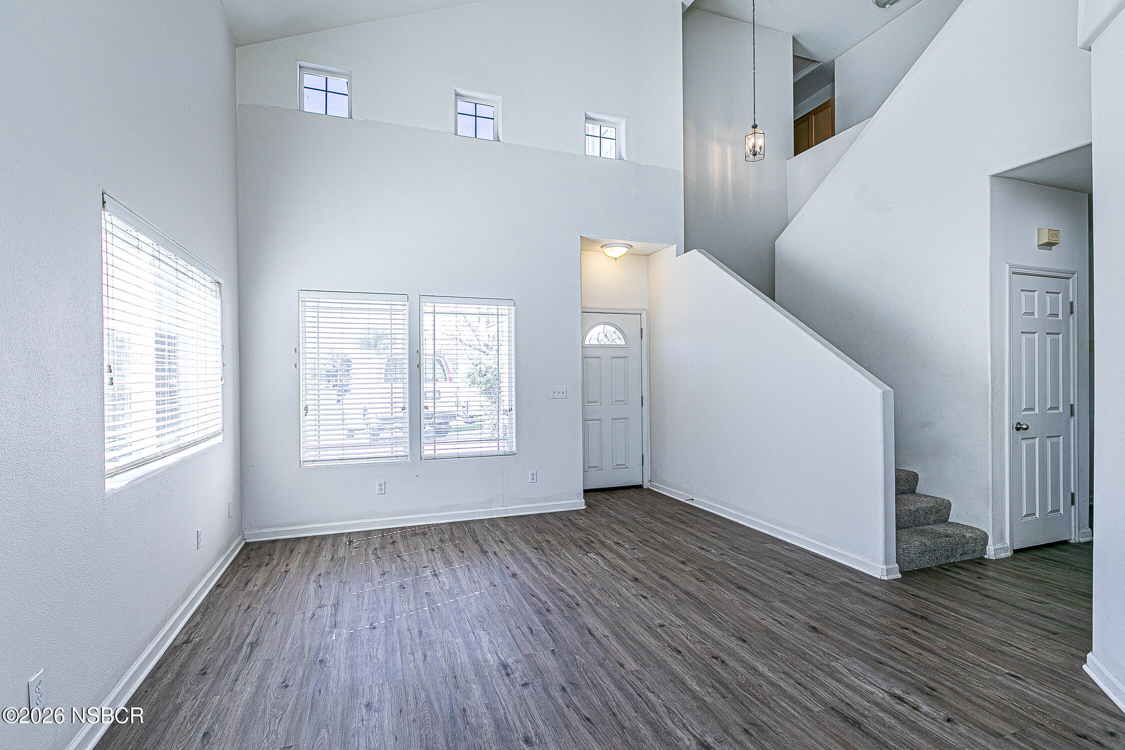 1838 Gable Lane Santa Maria, CA 93458 - Photo 4 of 31 a view of an empty room with wooden floor and a window