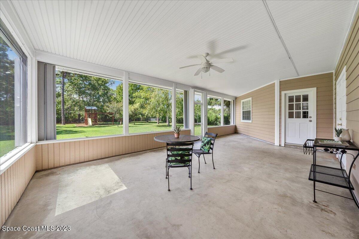 4150 Windover Way Melbourne, FL 32934 - Photo 19 of 57 a living room with furniture and a large window