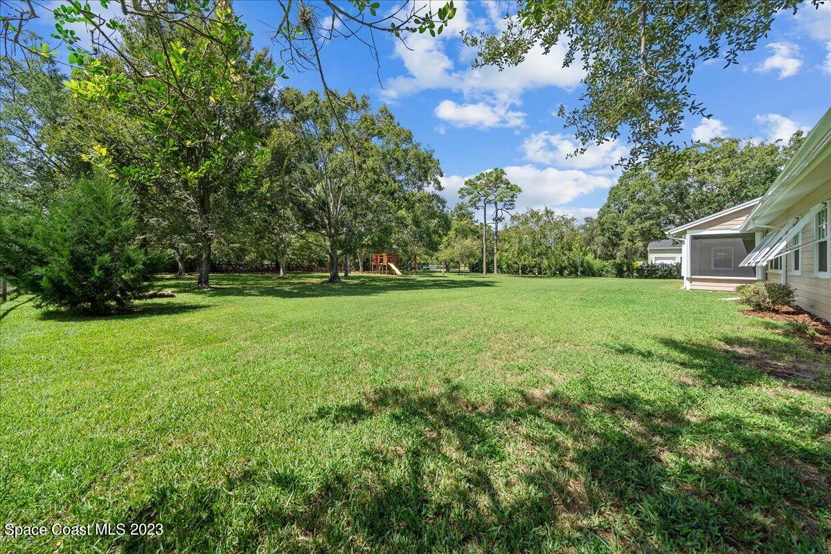 4150 Windover Way Melbourne, FL 32934 - Photo 40 of 57 a view of a house with a yard