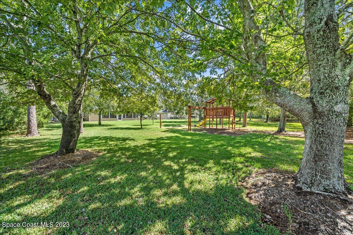 4150 Windover Way Melbourne, FL 32934 - Photo 4 of 57 a view of green field with trees in the background