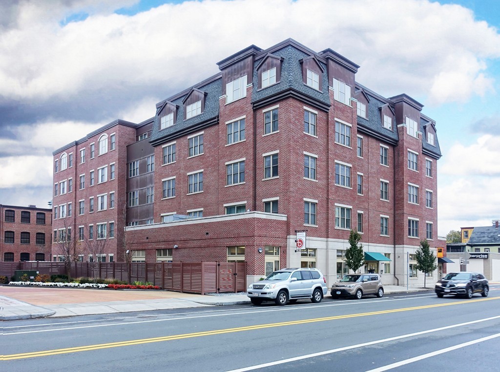 116 Rantoul Street, Unit 210 Beverly, MA 01915 - Photo 1 of 16 a view of a building and a street