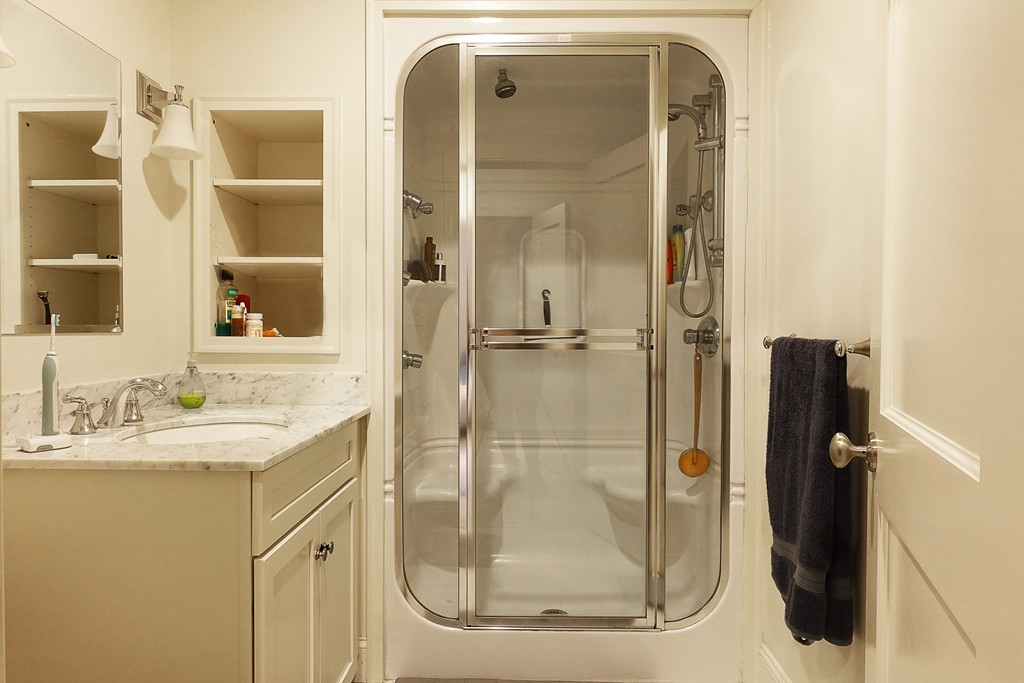 116 Rantoul Street, Unit 210 Beverly, MA 01915 - Photo 14 of 16 a bathroom with a shower and a sink