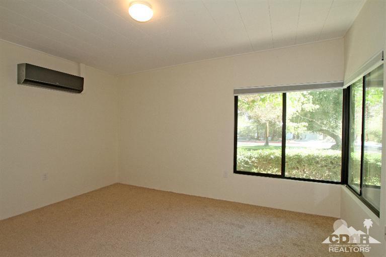 71523 Sahara Road Rancho Mirage, CA 92270 - Photo 14 of 30 an empty room with a window