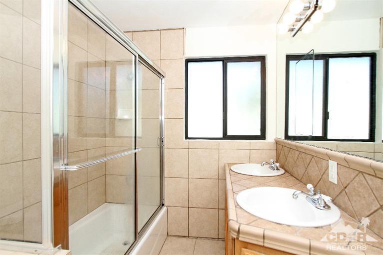 71523 Sahara Road Rancho Mirage, CA 92270 - Photo 15 of 30 a bathroom with a sink and a mirror