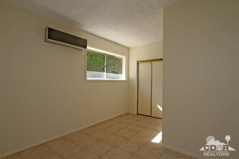 71523 Sahara Road Rancho Mirage, CA 92270 - Photo 17 of 30 an empty room with windows