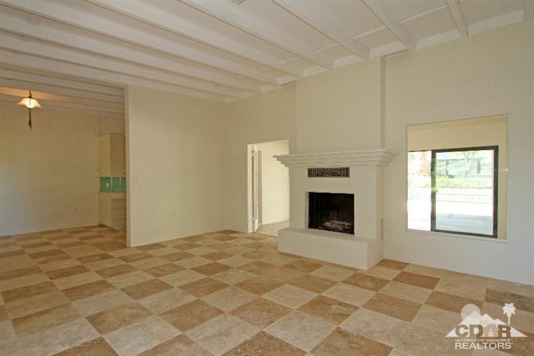 71523 Sahara Road Rancho Mirage, CA 92270 - Photo 3 of 30 a view of an empty room with window and fire place