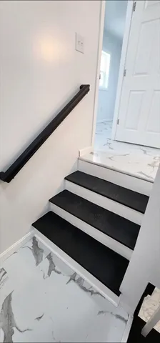 a bathroom with a mirror and a shower