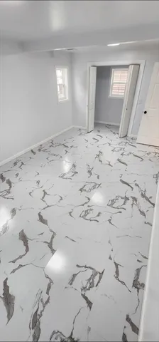 a view of a refrigerator in a kitchen