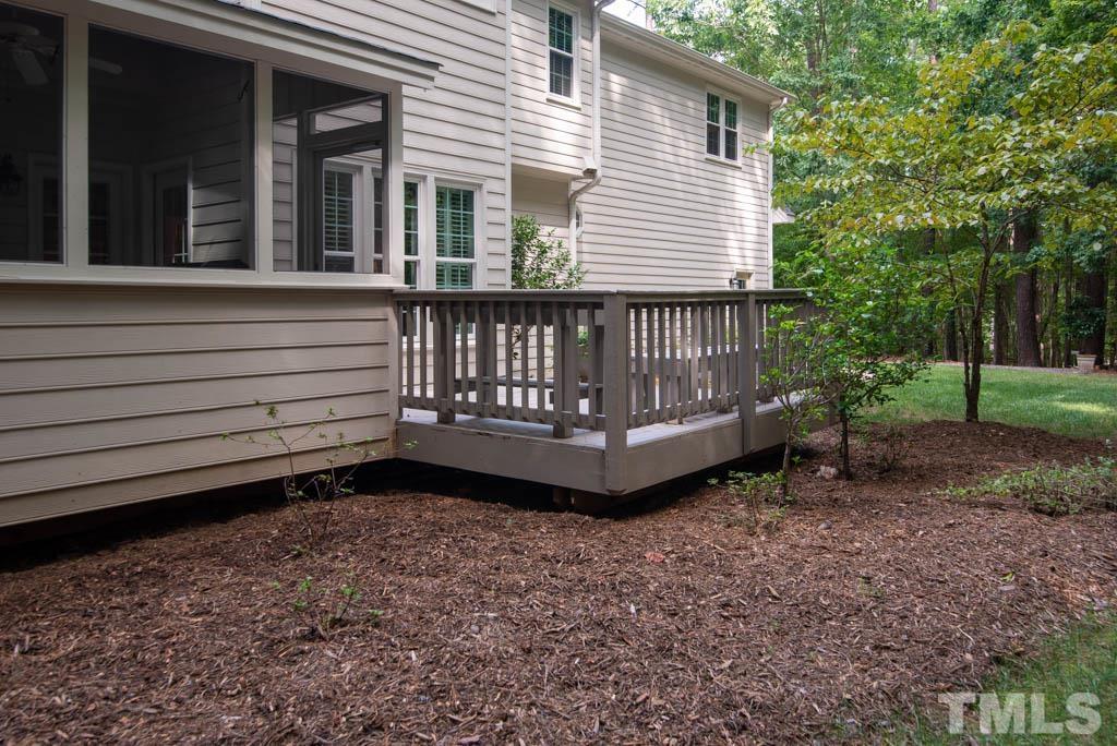 2500 Barton Ridge Court Raleigh, NC 27613 - Photo 54 of 60 a view of a house with a yard and wooden fence