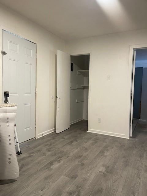 12435 Oberlin Drive Dallas, TX 75243 - Photo 19 of 19 an empty room with cabinet and wooden door