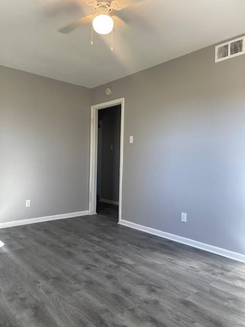 12435 Oberlin Drive Dallas, TX 75243 - Photo 4 of 19 a view of an empty room with wooden floor and a window