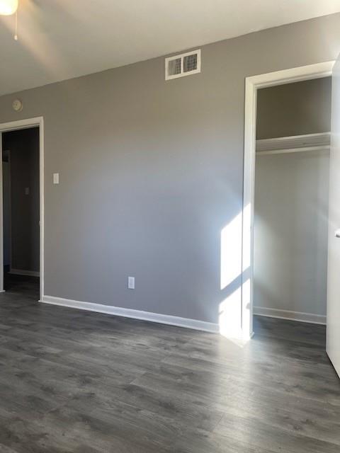 12435 Oberlin Drive Dallas, TX 75243 - Photo 6 of 19 a view of an empty room with wooden floor and closet