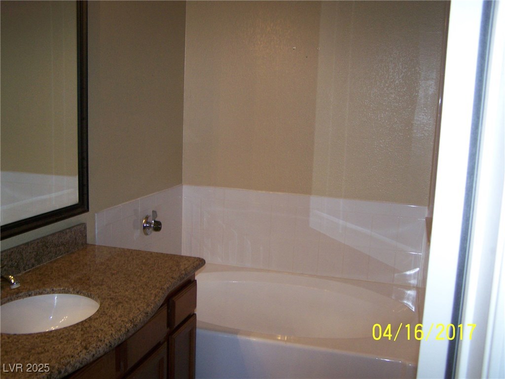 10245 King Henry Avenue, Unit 202 Las Vegas, NV 89144 - Photo 27 of 30 master bath...separate bath and shower.