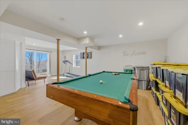 a room with furniture and pool table