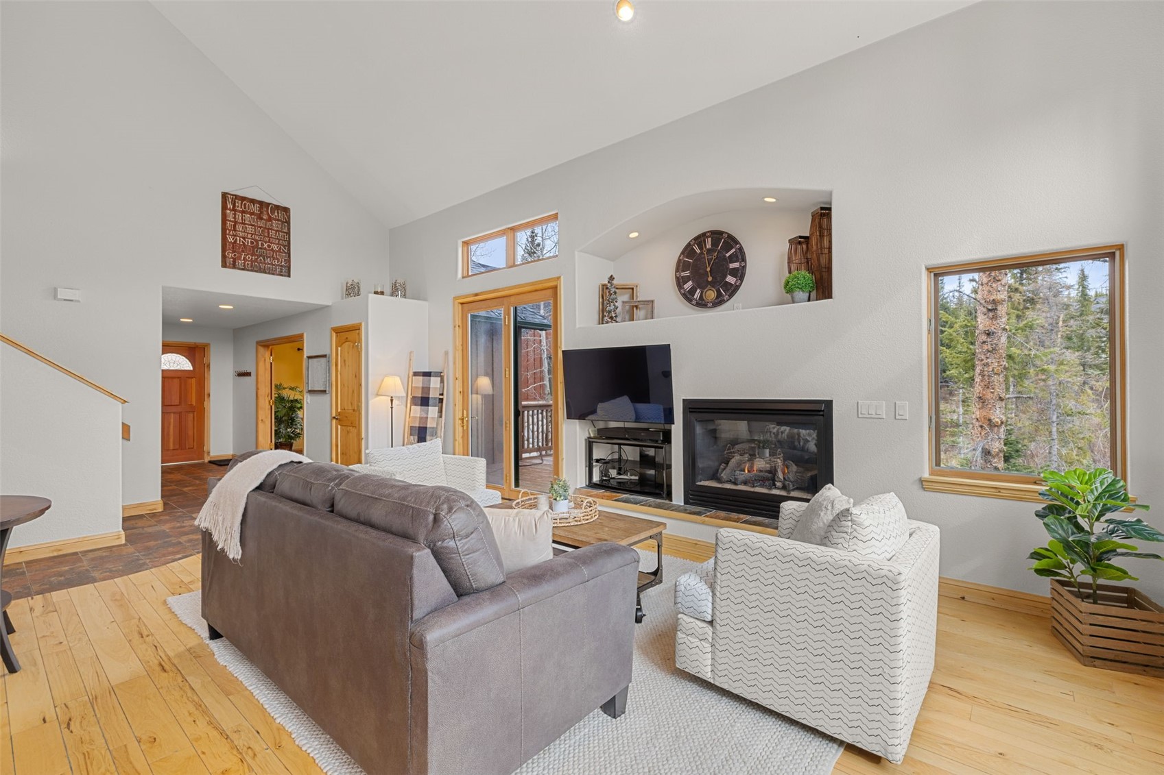 91795 Ryan Gulch Road Silverthorne, CO 80498 - Photo 15 of 50 a living room with fireplace furniture and a large window