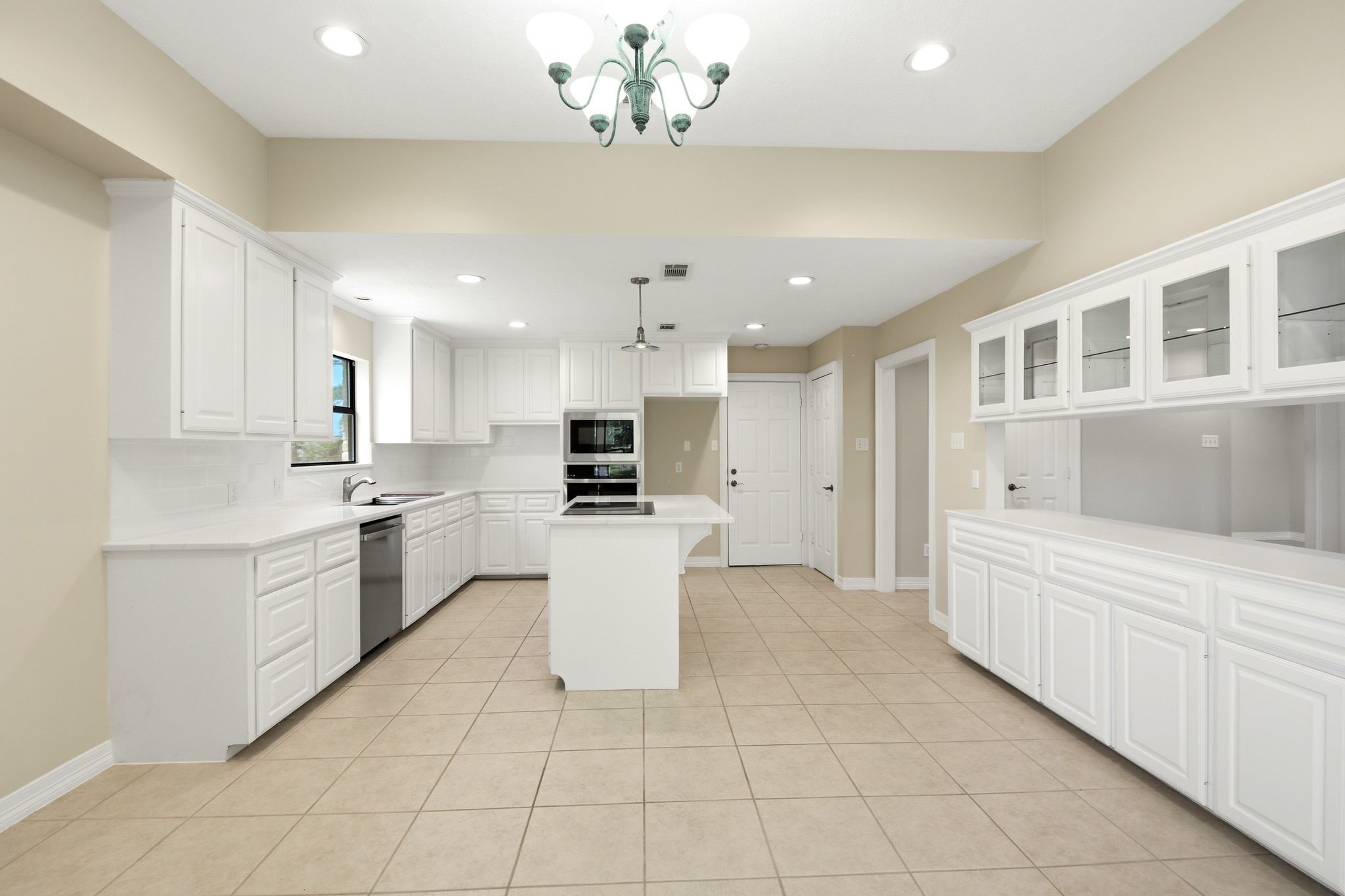 22509 Pebble Beach Way Point Blank, TX 77364 - Photo 9 of 30 Remodeled kitchen with center island and stainless appliances