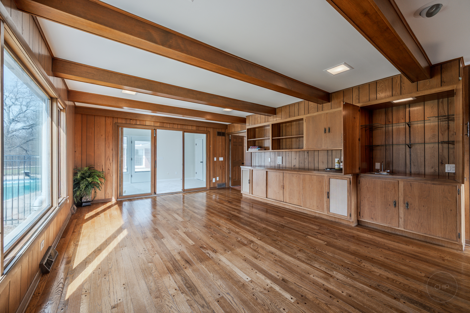 15600 Griswold Springs Road Plano, IL 60545 - Photo 23 of 96 a view of empty room with wooden floor and fan