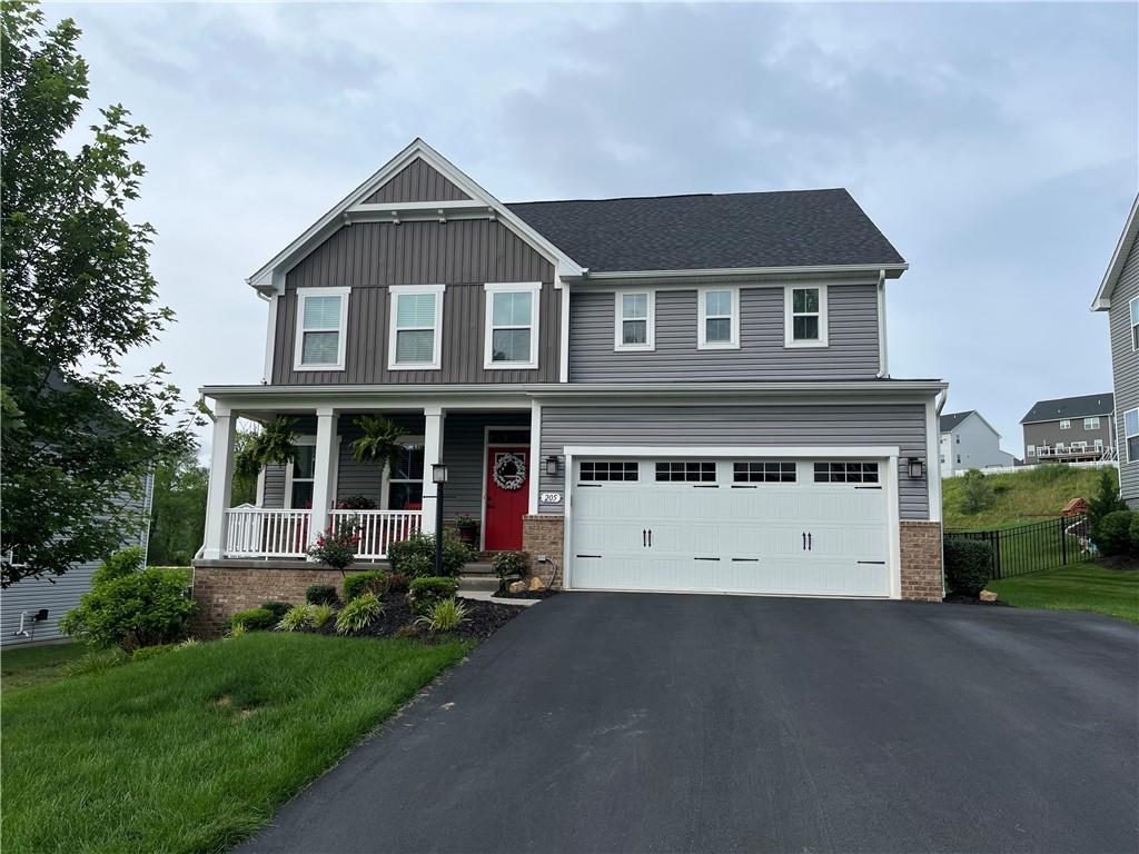 205 Regency Drive Eighty Four, PA 15330 - Photo 1 of 43 a front view of a house with a garden and garage