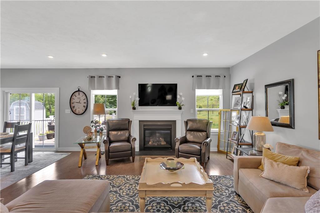 205 Regency Drive Eighty Four, PA 15330 - Photo 15 of 43 a living room with furniture a fireplace and a flat screen tv