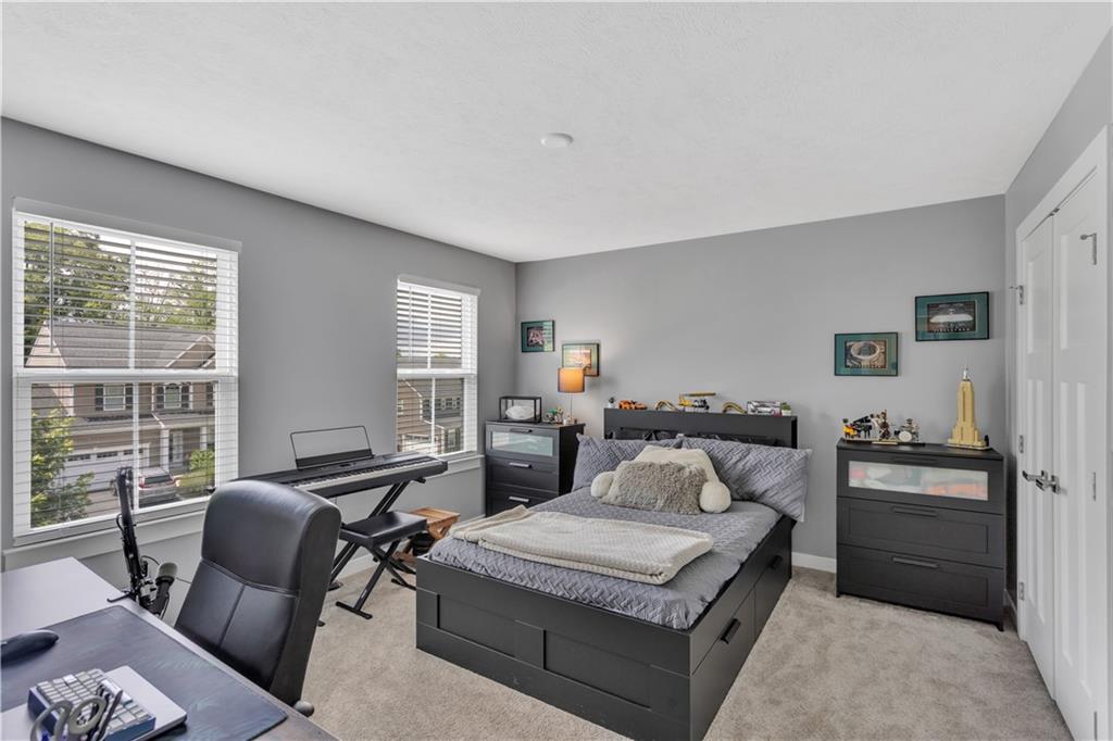 205 Regency Drive Eighty Four, PA 15330 - Photo 19 of 43 a bedroom with a bed and wooden floor