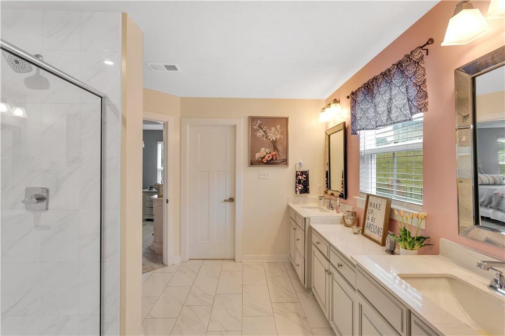205 Regency Drive Eighty Four, PA 15330 - Photo 27 of 43 a large bathroom with a granite countertop tub a sink and a large mirror