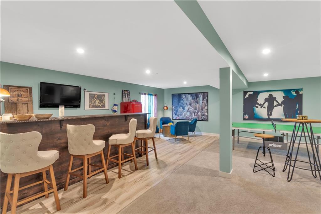 205 Regency Drive Eighty Four, PA 15330 - Photo 29 of 43 a living room with furniture a flat screen tv and kitchen view