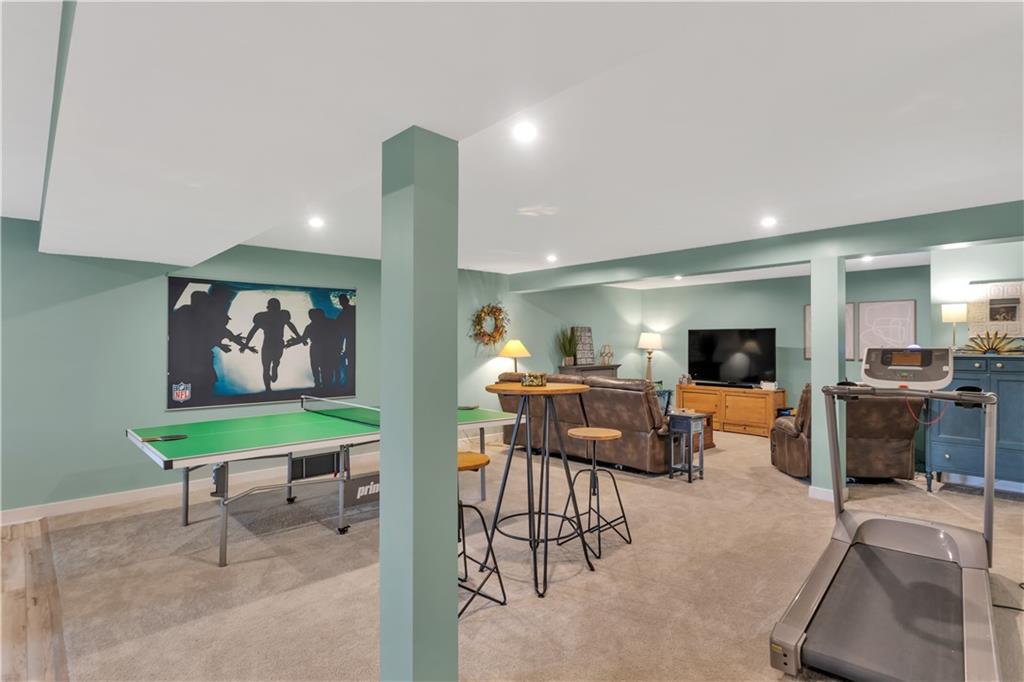 205 Regency Drive Eighty Four, PA 15330 - Photo 32 of 43 a living room with furniture and a flat screen tv