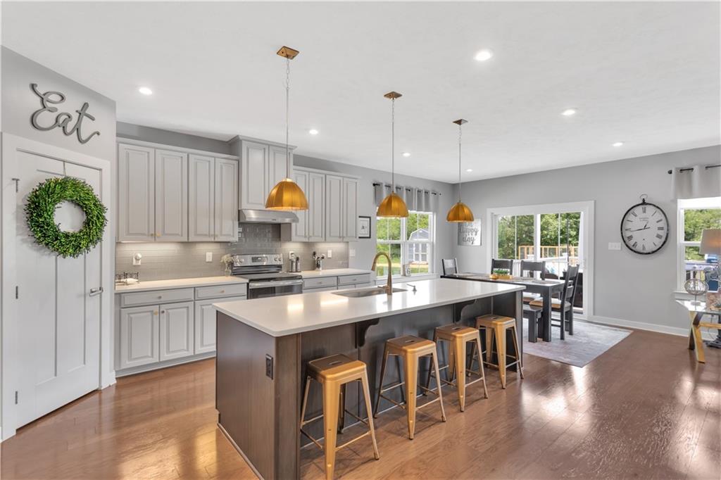 205 Regency Drive Eighty Four, PA 15330 - Photo 10 of 43 a kitchen with counter space dining table and wooden floor
