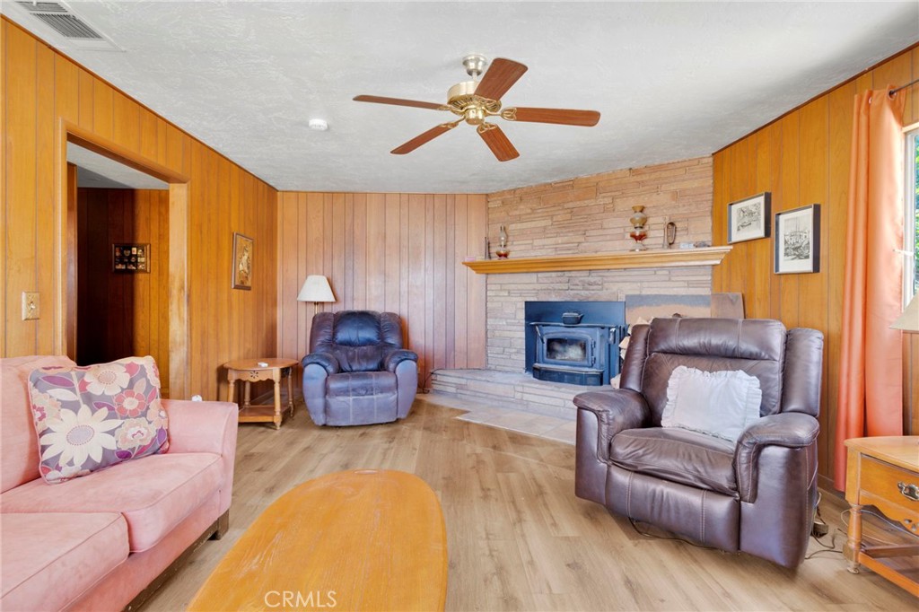 5500 Oil Well Road Phelan, CA 92371 - Photo 17 of 65 a living room with furniture and a fireplace