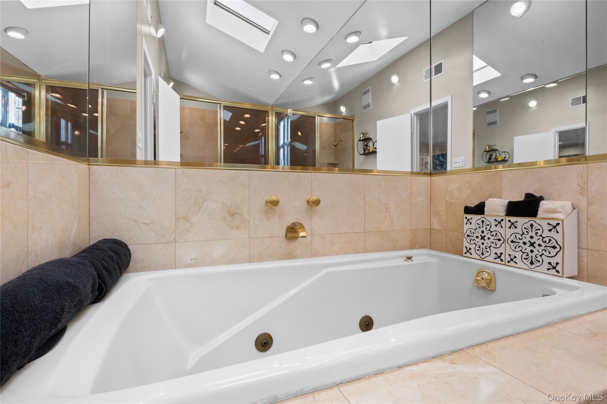 19 Jacob Road Plainview, NY 11803 - Photo 19 of 33 a bath tub sitting in a bathroom and a sink
