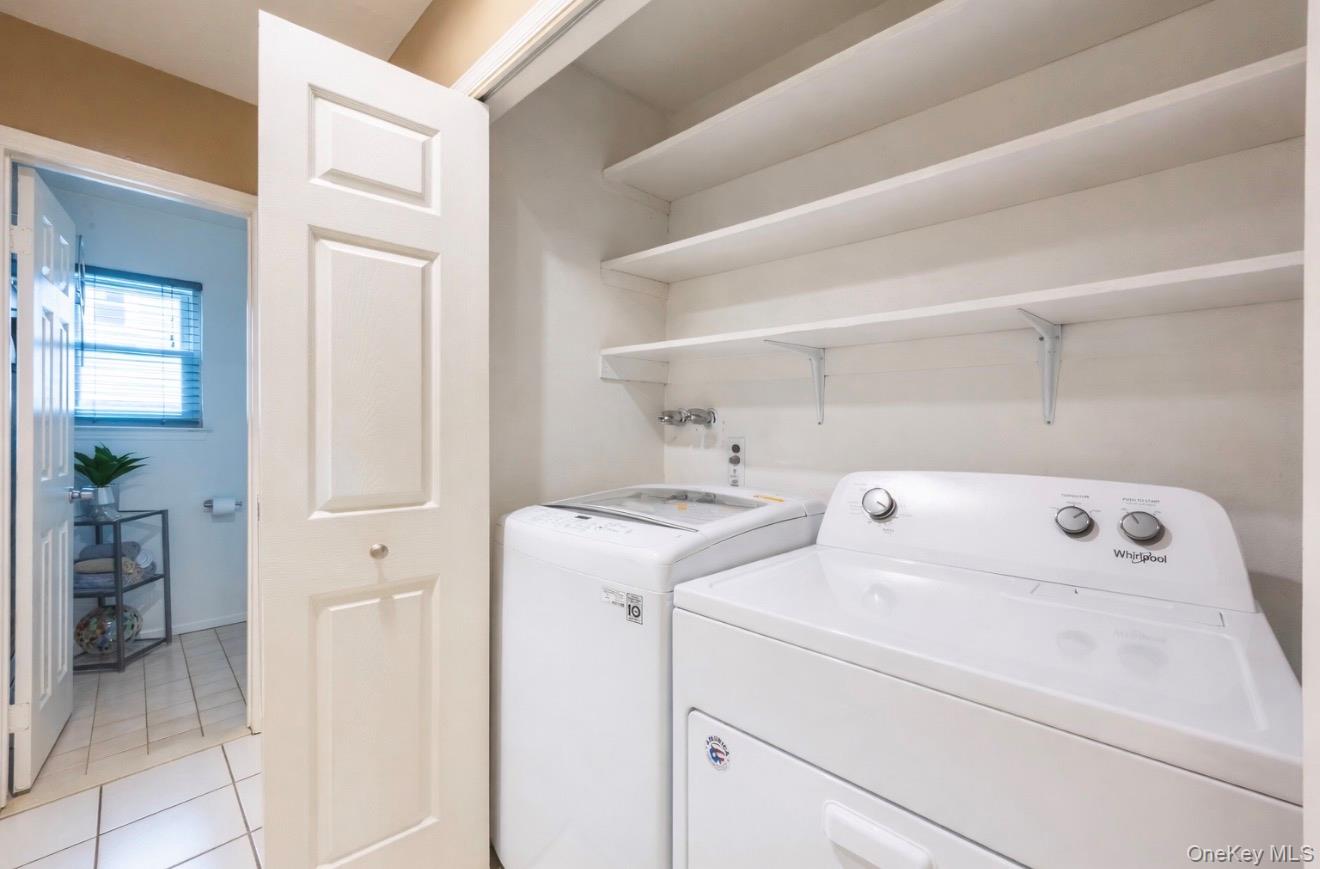 19 Jacob Road Plainview, NY 11803 - Photo 26 of 33 a view of storage and utility room with washer and dryer