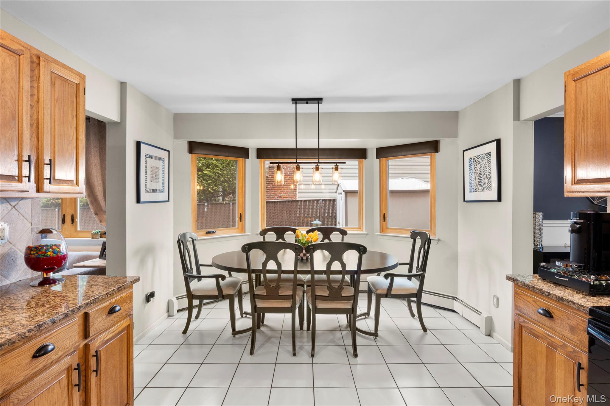 19 Jacob Road Plainview, NY 11803 - Photo 8 of 33 a view of a dining room with furniture and chandelier