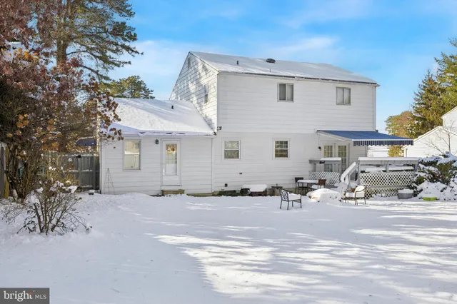 a view of a house with snow on the road