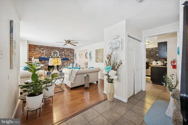 a view of a dining room with furniture wooden floor and a chandelier