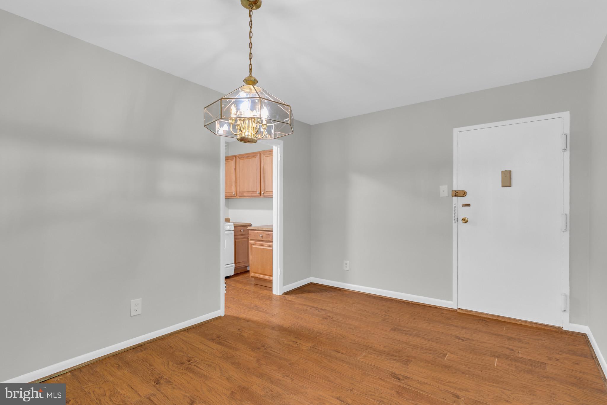 11620 Vantage Hill Road, Unit 22B Reston, VA 20190 - Photo 11 of 24 a view of empty room with wooden floor and window