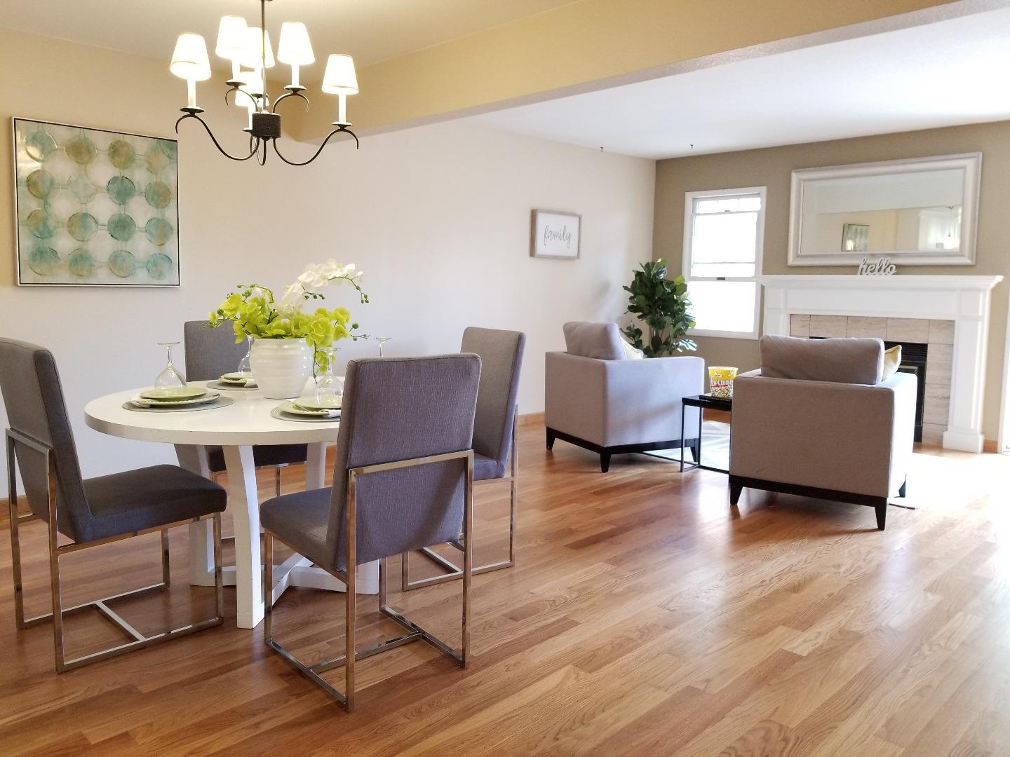 161 Redding Road Campbell, CA 95008 - Photo 4 of 21 a dining room with wooden floor a chandelier a glass table and chairs