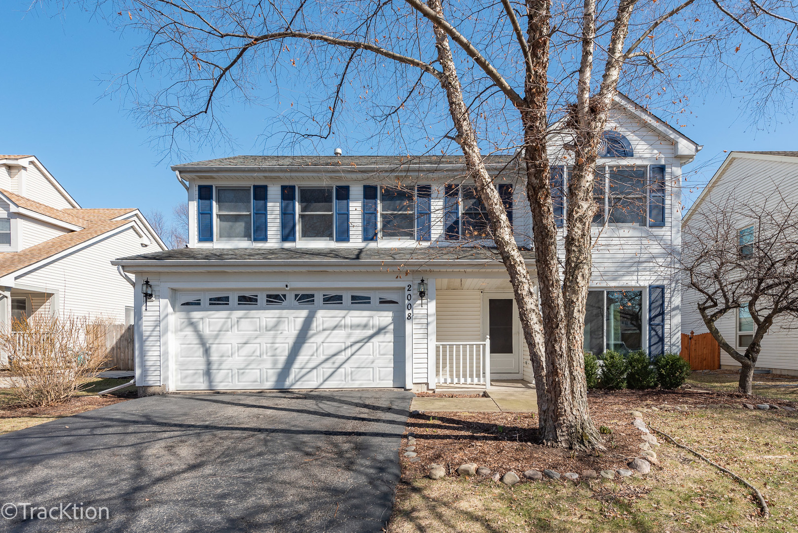 a front view of a house with garage
