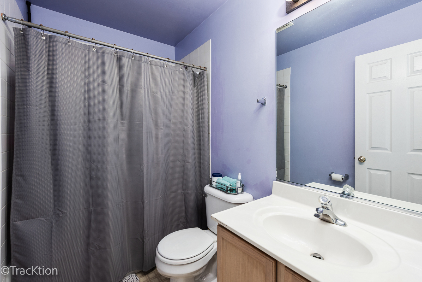 2008 Primrose Drive Plainfield, IL 60586 - Photo 17 of 26 a bathroom with a sink a toilet and shower curtain