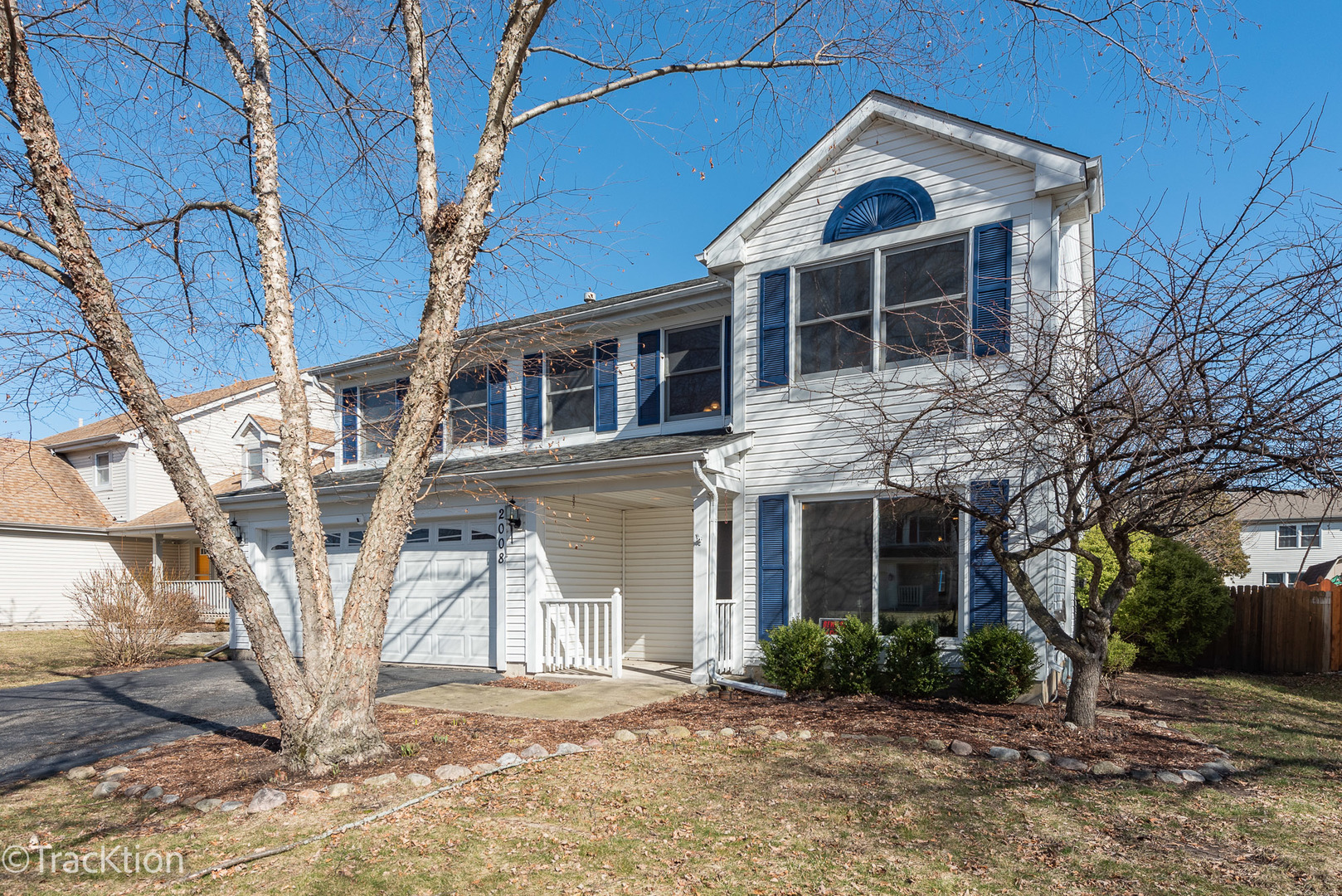 2008 Primrose Drive Plainfield, IL 60586 - Photo 2 of 26 a view of a white house with large windows and a yard