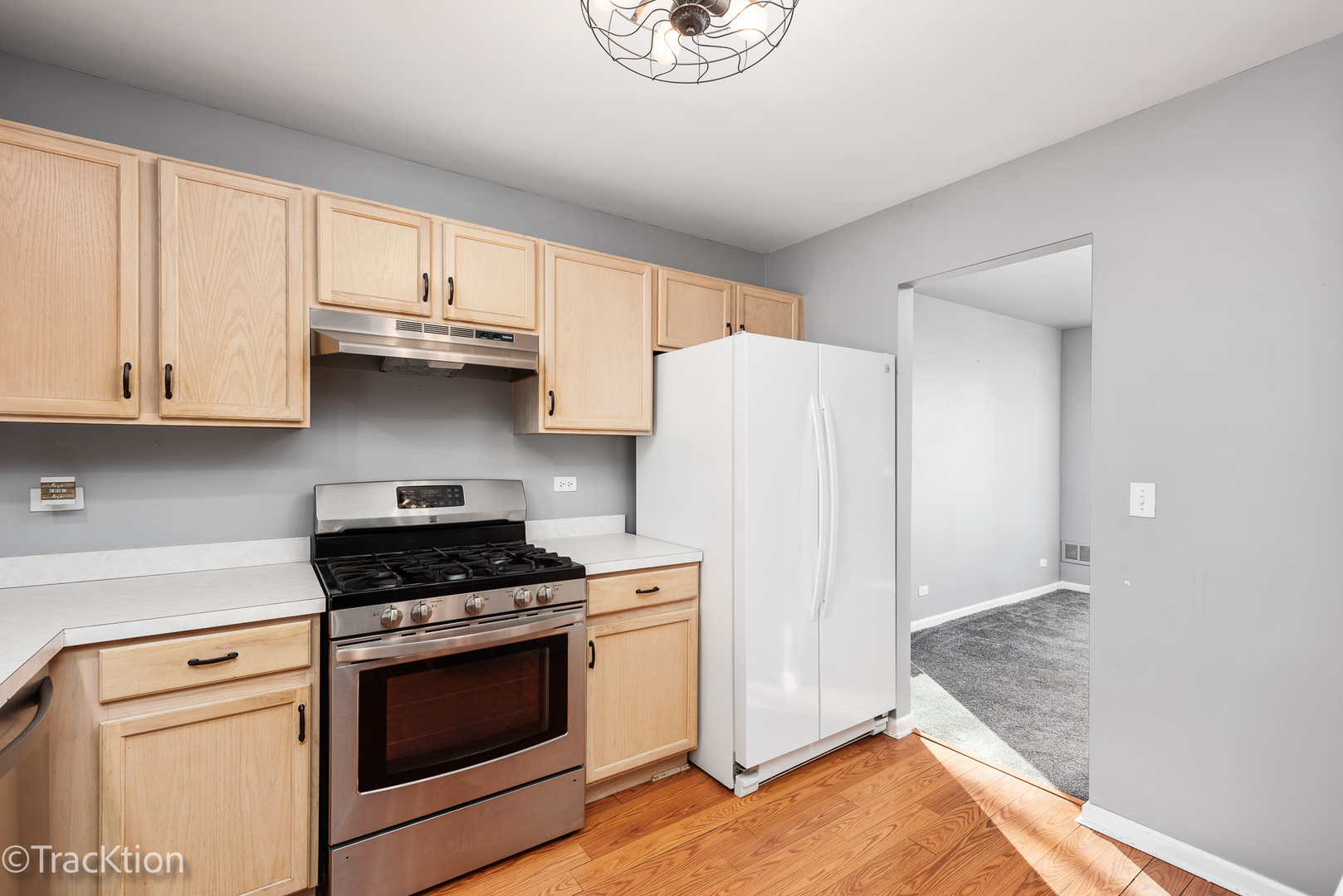 2008 Primrose Drive Plainfield, IL 60586 - Photo 5 of 26 a kitchen with stainless steel appliances white cabinets and a stove top oven