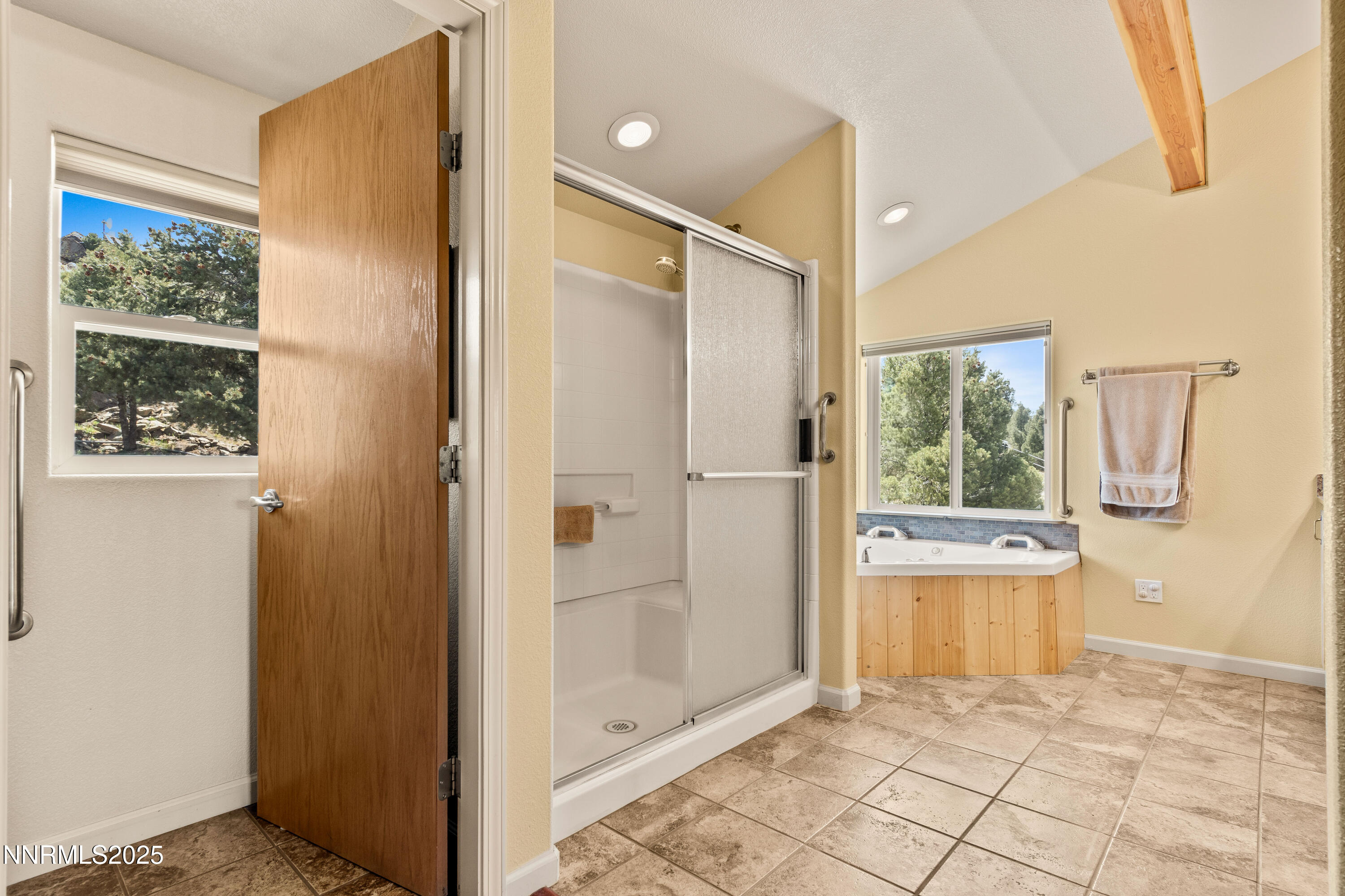 2140 Conestoga Road Reno, NV 89521 - Photo 12 of 35 a bathroom with a glass shower door and a window