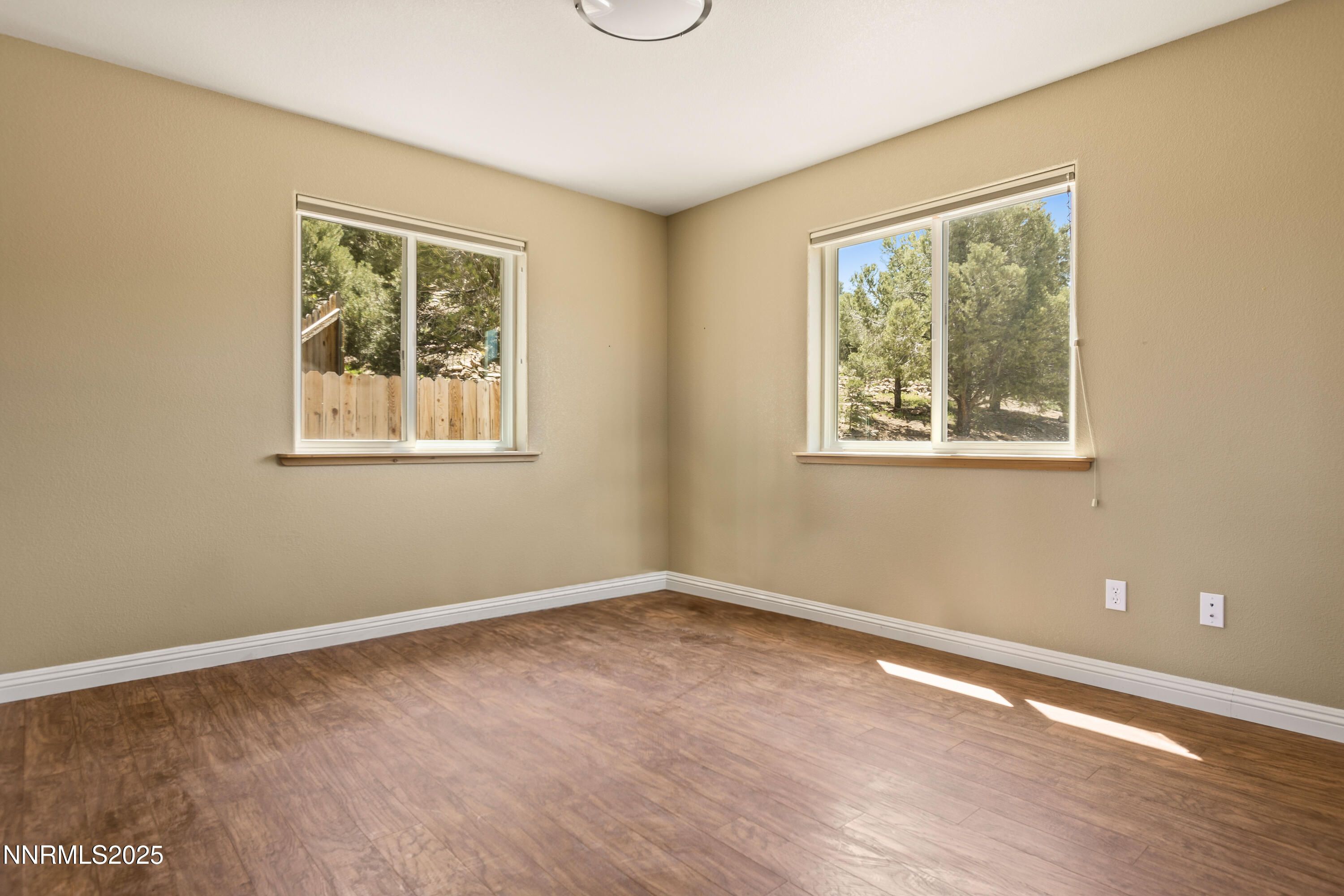 2140 Conestoga Road Reno, NV 89521 - Photo 18 of 35 a view of an empty room with wooden floor and a window