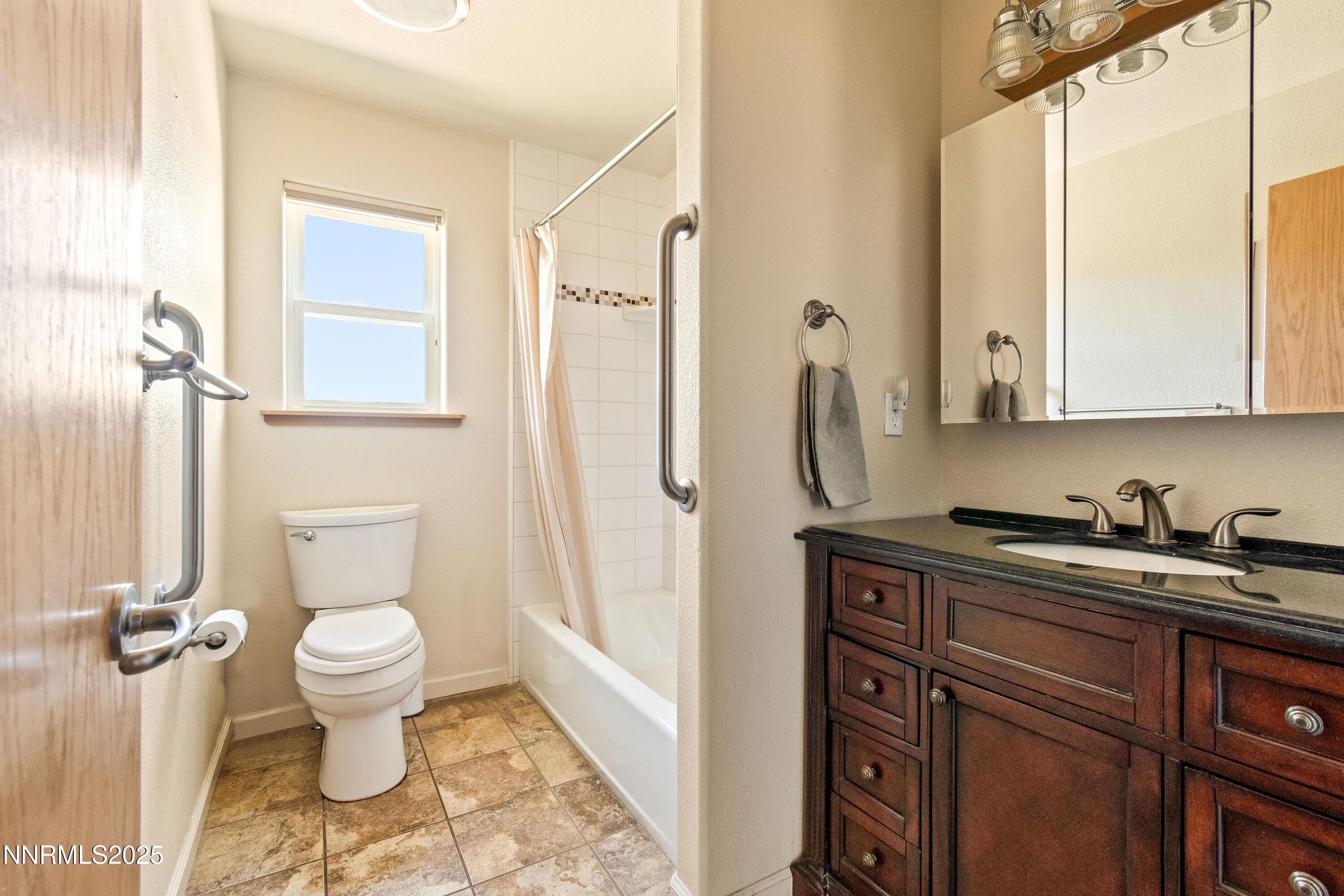 2140 Conestoga Road Reno, NV 89521 - Photo 21 of 35 a bathroom with a granite countertop toilet sink and mirror