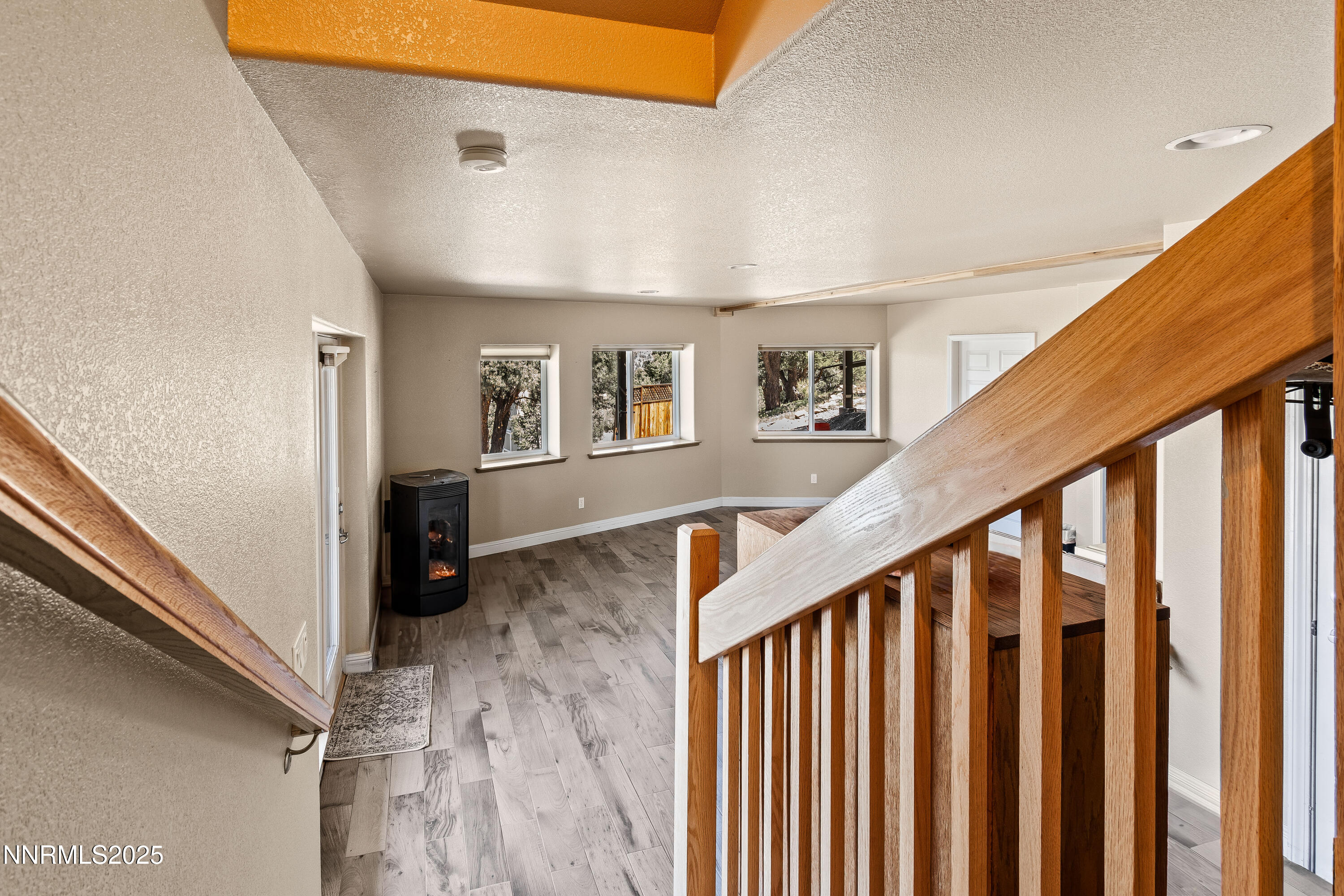 2140 Conestoga Road Reno, NV 89521 - Photo 23 of 35 a view of a hallway with wooden floor and staircase